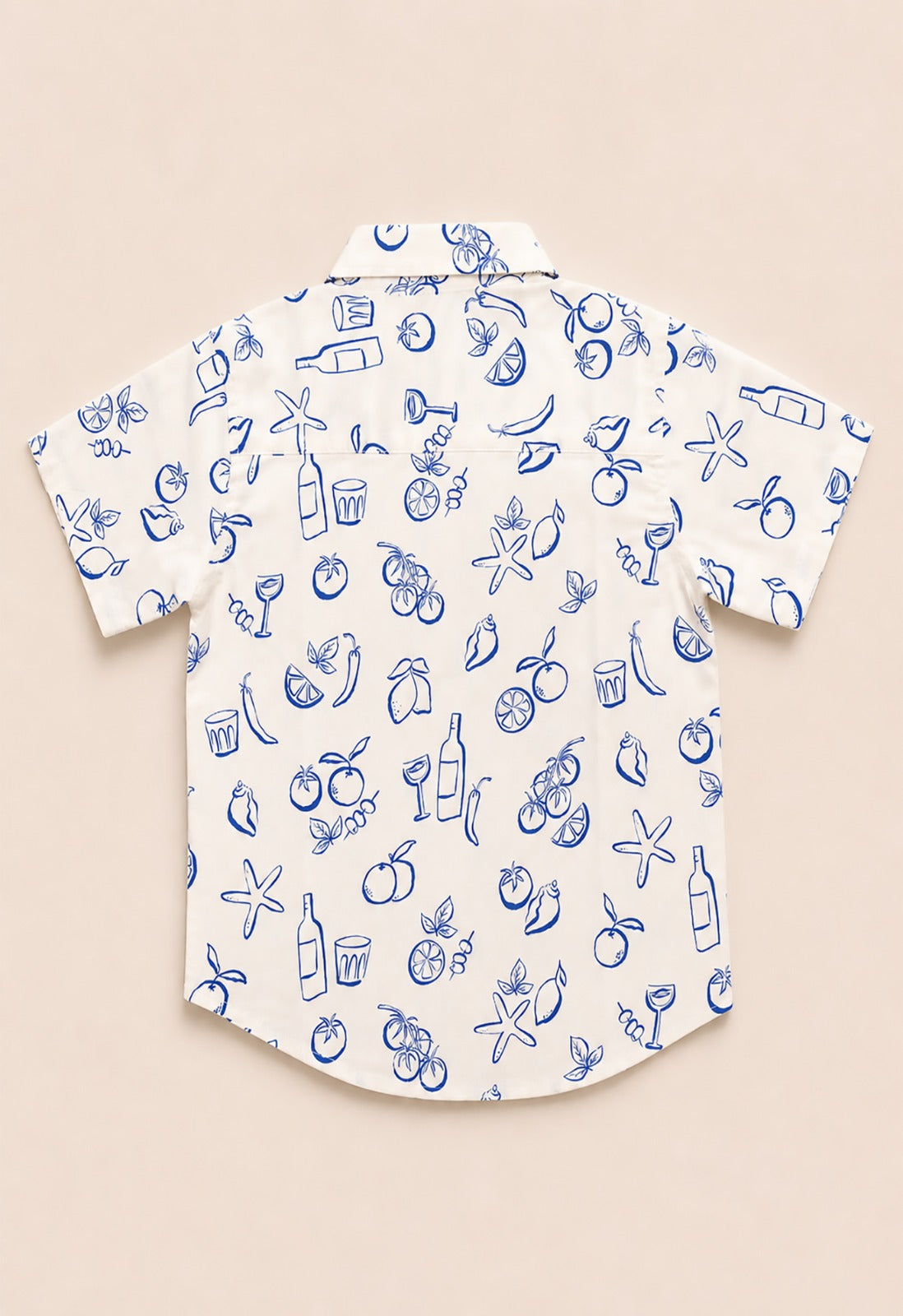 Back view of a white kids short-sleeve button-down shirt showing the blue outline Mediterranean fruit and coastal pattern.