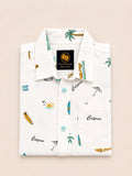 Neatly folded white kids button-down shirt displaying the retro California beach club graphics and contrasting turquoise buttons.