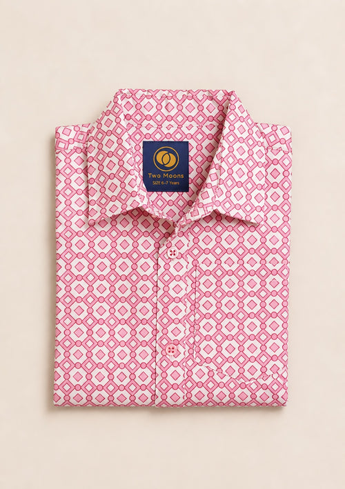 Neatly folded pink and white kids button-down shirt highlighting the geometric diamond pattern and matching pink buttons.
