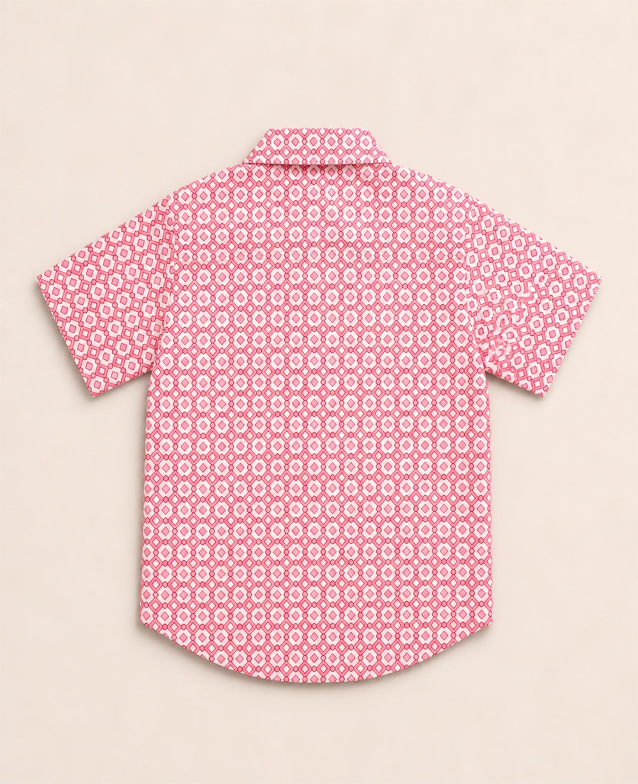 Back view of a pink and white kids short-sleeve button-down shirt showing the repeating geometric diamond print.
