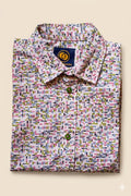 Folded Two Moons Canada kids short-sleeve button-down shirt featuring a pastel geometric mosaic print with contrasting green buttons.