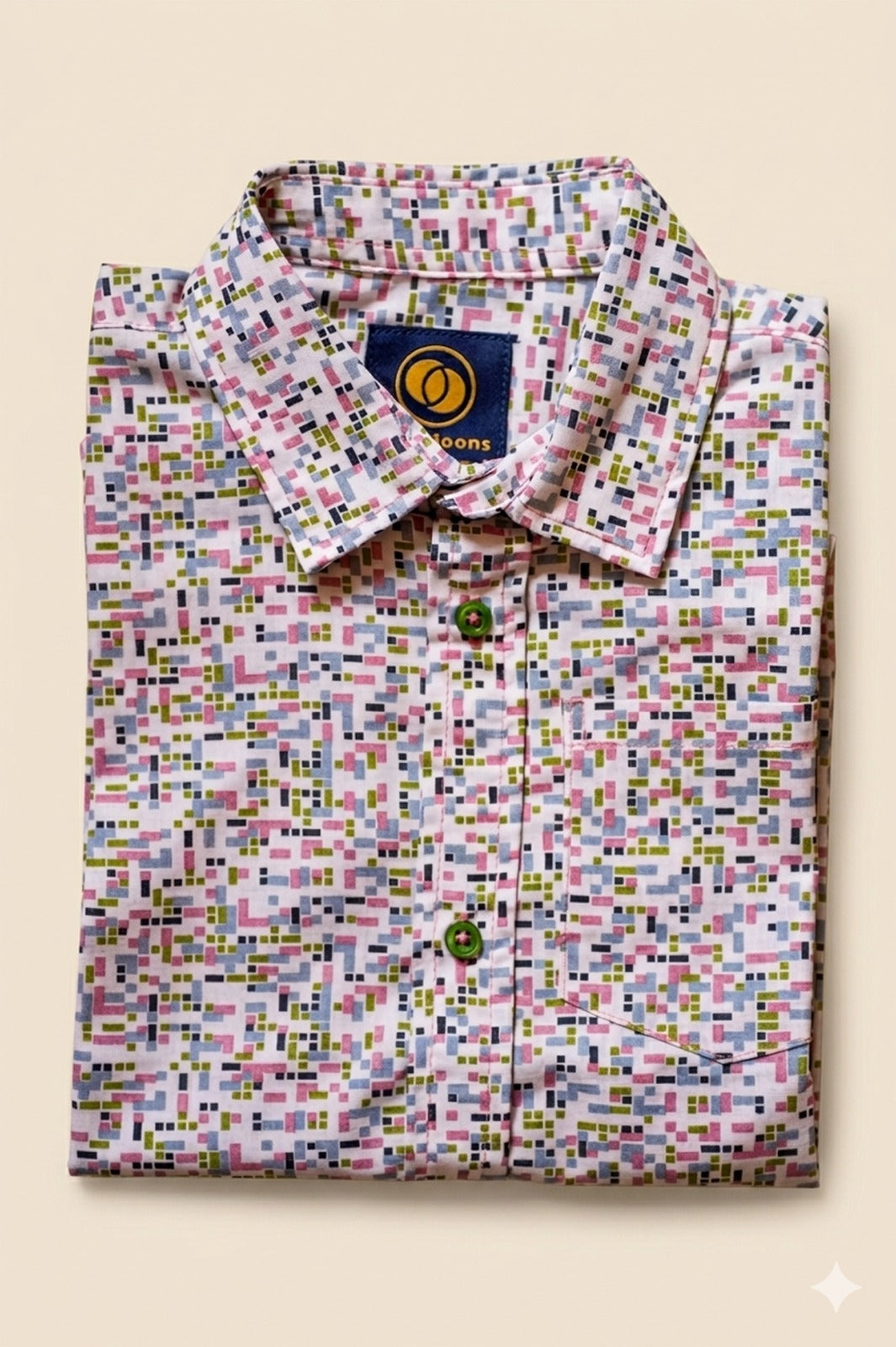 Folded Two Moons Canada kids short-sleeve button-down shirt featuring a pastel geometric mosaic print with contrasting green buttons.