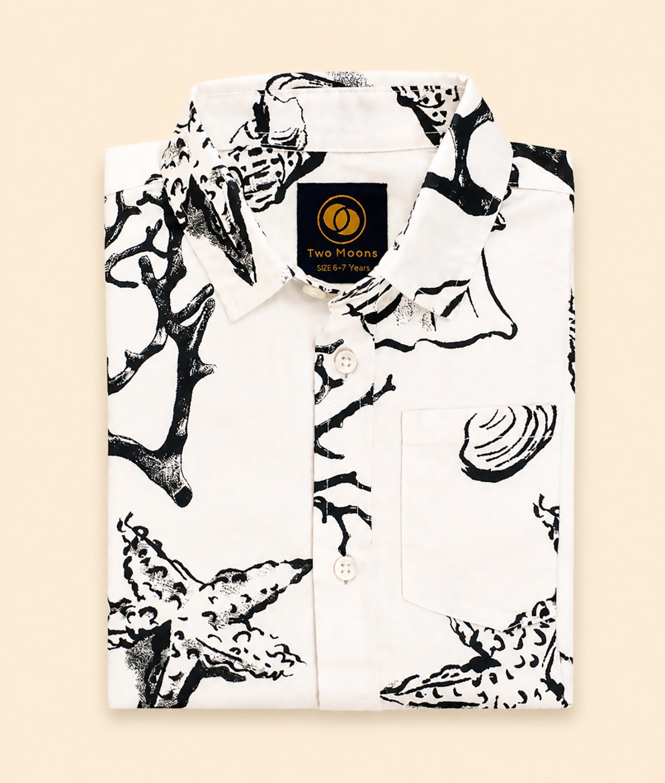 Folded Two Moons Canada kids short-sleeve button-down shirt featuring a black and white illustrated sea life print with coral and starfish.