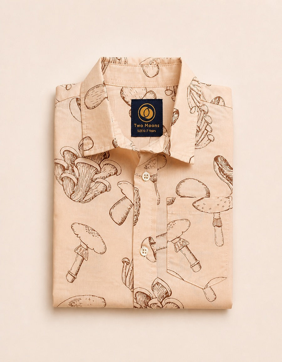 Folded Two Moons Canada kids short-sleeve button-down shirt featuring a brown vintage botanical mushroom print on a beige background