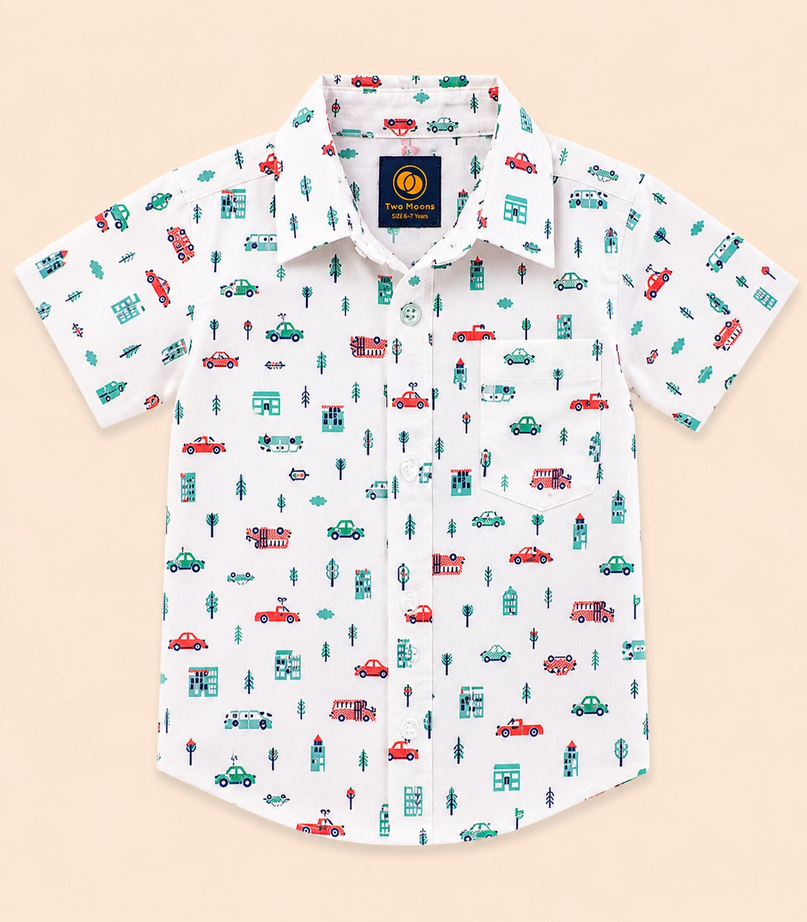 Front view of a white kids short-sleeve button-down shirt featuring a colorful town print with cars, buses, buildings, and trees.