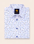 Neatly folded white kids button-down shirt highlighting the delicate blue abstract confetti pattern and contrasting dark navy buttons.